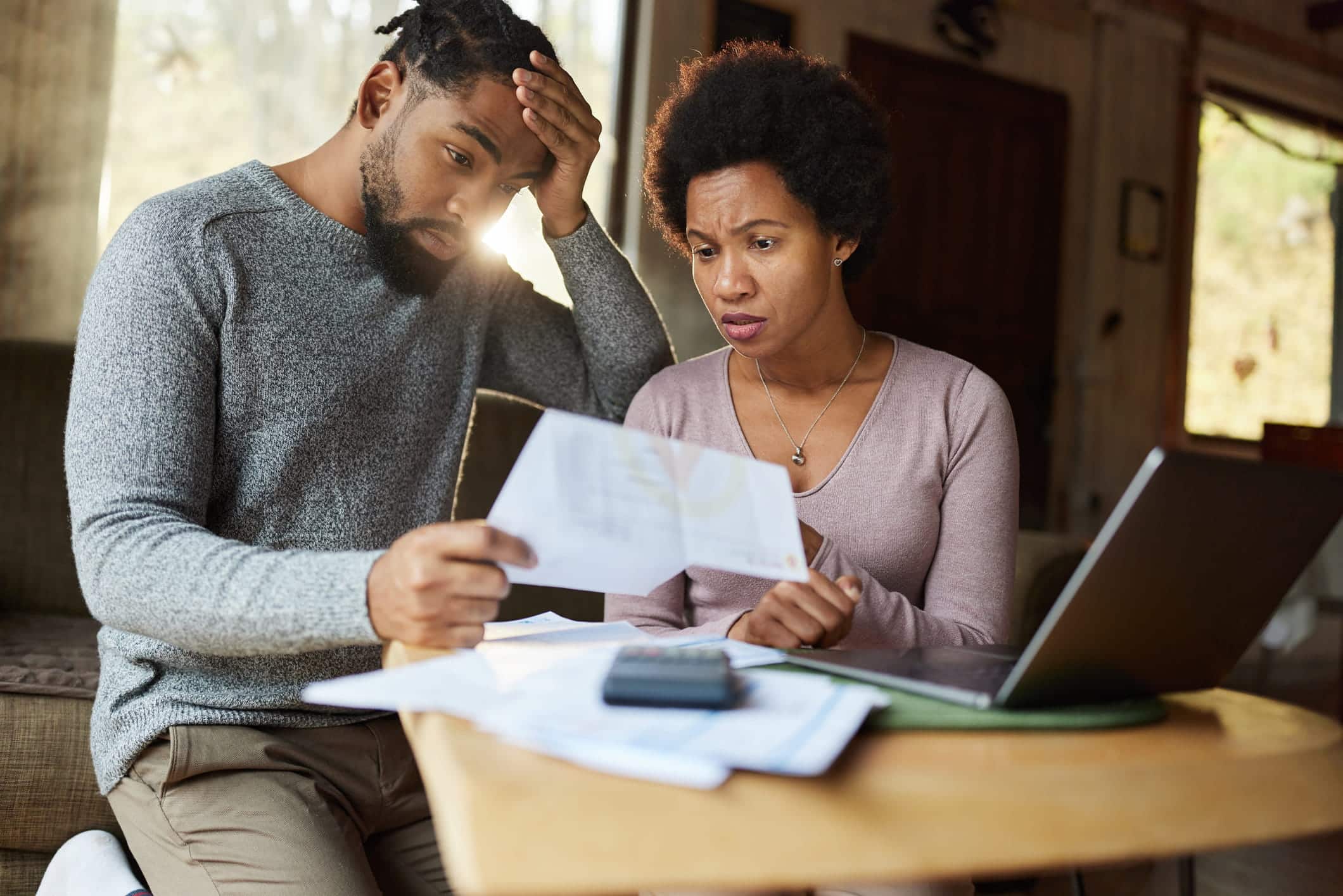stressed couple looking at bankruptcy exemptions document