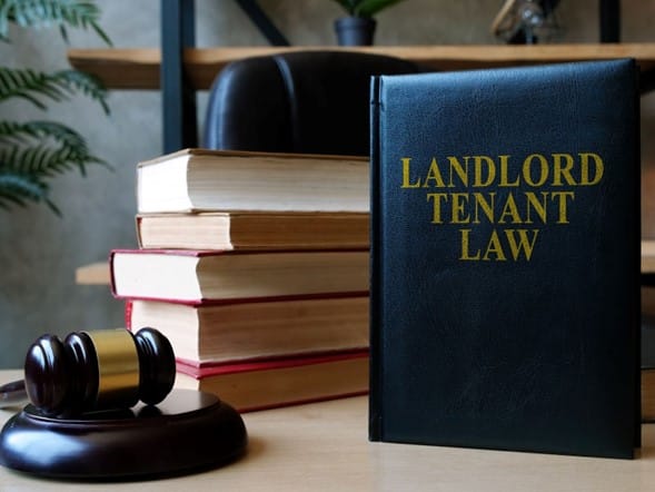 landlord tenant law book on desk